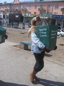 A volunteer from Appleby College carries donations to her placement abroad A volunteer from Appleby College carries donations to her placement abroad