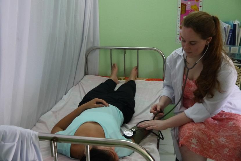 A Projects Abroad intern learns how to examine vital signs on a fellow intern at a medical placement in Vietnam A Projects Abroad intern learns how to examine vital signs on a fellow intern at a medical placement in Vietnam