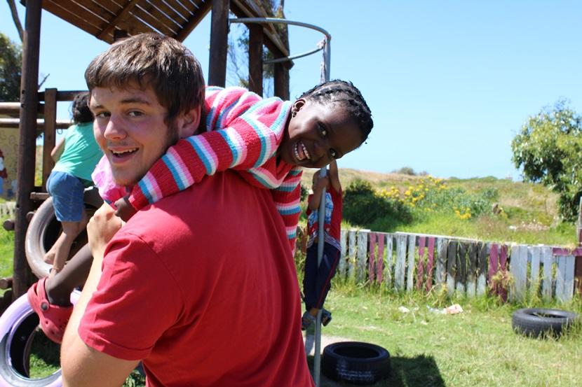 A Projects Abroad volunteer and a local child during playtime at a Care placement in Cape Town, South Africa. A Projects Abroad volunteer and a local child during playtime at a Care placement in Cape Town, South Africa.