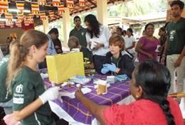 Sri Lanka Student volunteers on the Sri Lanka Medicine High School Special assist at an outreach.