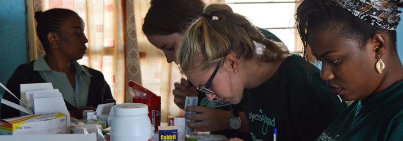 Pharmacy Elective students assist with dispensing medication during an outreach abroad. Pharmacy Elective students assist with dispensing medication during an outreach abroad.