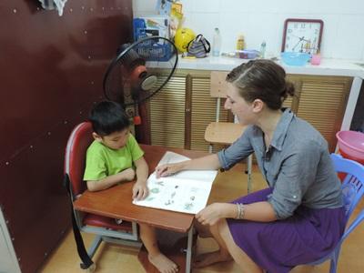 A female volunteer works with a Vietnamese child at the Occupational Therapy project A professional Occupational Therapy volunteer at a placement in Vietnam