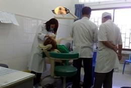 Cambodia An experienced volunteer performs a dental procedure on a patient in Cambodia.