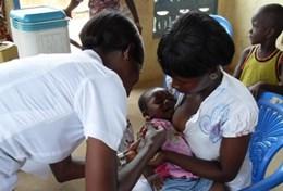Ghana A nursing intern checks the vital signs of a child in Ghana during his volunteer project.