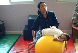 Cambodia A therapist uses techniques taught by a physiotherapist volunteering in Cambodia.