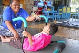 Samoa A local physical therapist uses techniques taught by a volunteer to help a patient in Samoa.