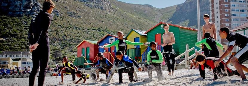 Volunteers on the Surfing Project coach children in South Africa with Projects Aboard. Volunteers on the Surfing Project coach children in South Africa with Projects Aboard.