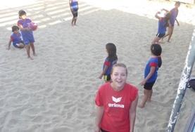 Sports A volunteer coaches a volleyball lesson for young students in Bolivia.